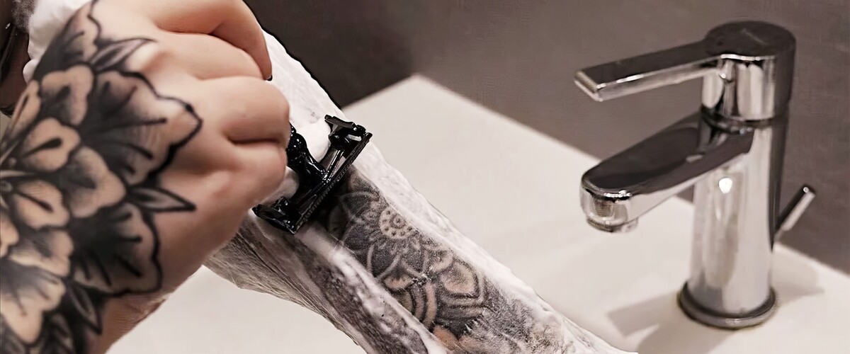 when is it safe to shave over a tattoo